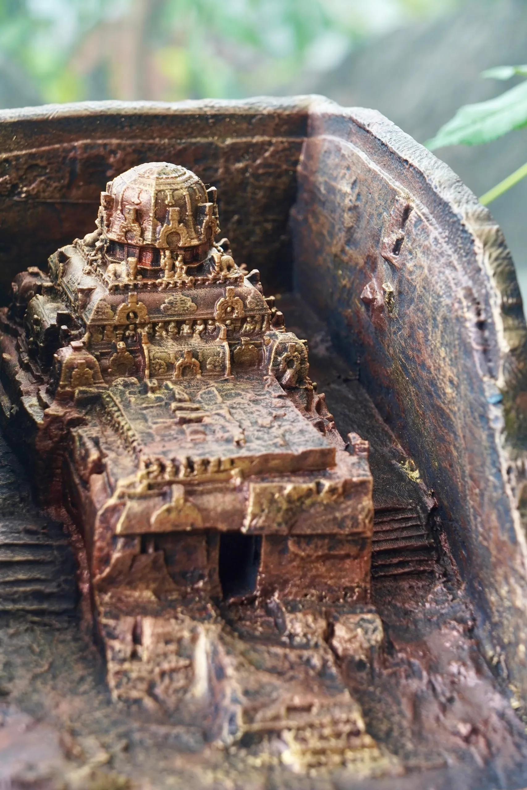 A 3D-printed replica of Vettuvan Koil photographed upright, showing the full height of the unfinished monolith.
